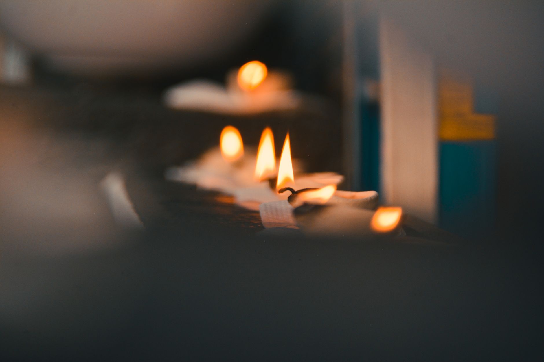 Close-up of flickering candle flames creating a warm atmosphere.